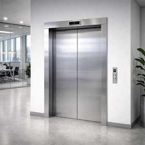 commercial-building-hydraulic-lift-ahmedabad Hydraulic passenger lift setup in a commercial building in Ahmedabad.