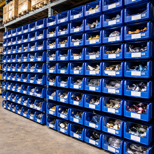 front-partly-open-storage-crates-warehouse Front partly open storage crates stacked for easy picking in an Indian warehouse.
